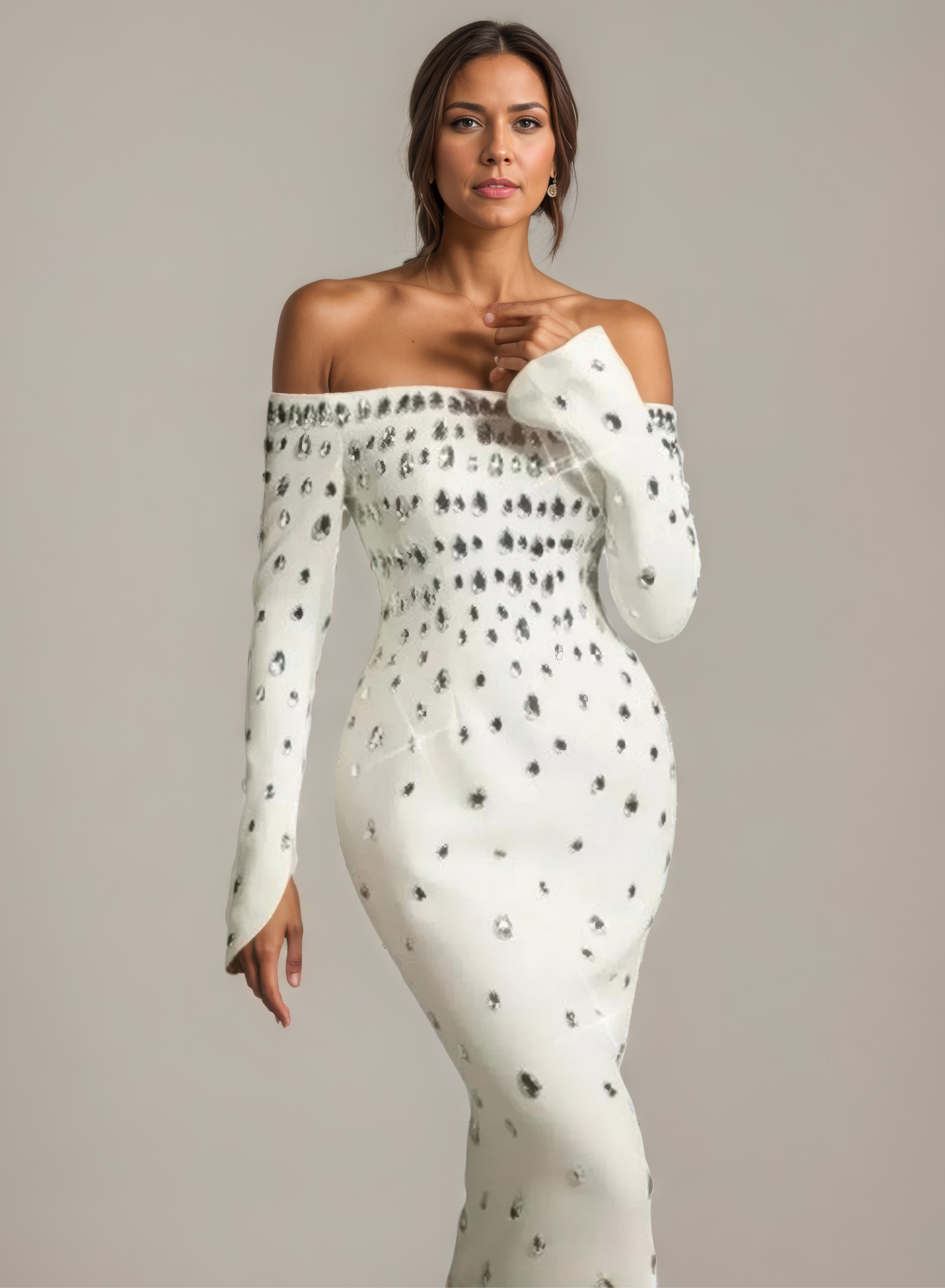 Woman wearing a white off-shoulder dress with black patterns against a gray background