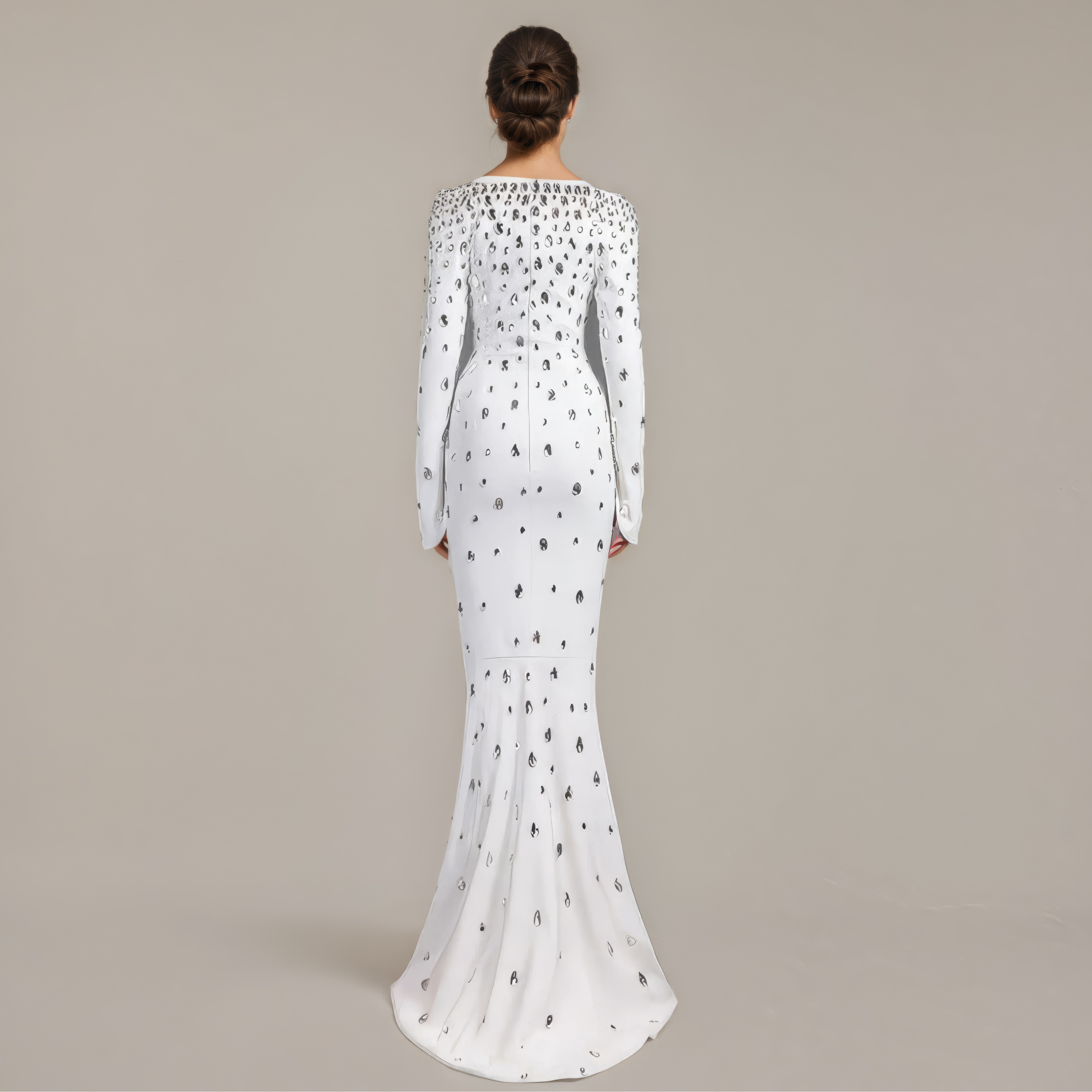 White evening gown with long sleeves on a beige background