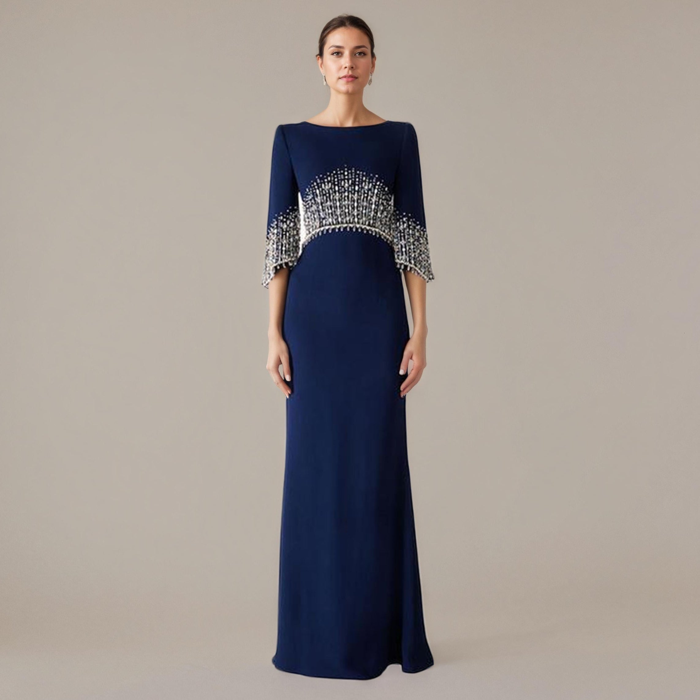 Navy blue evening gown with silver embellishments on a beige background