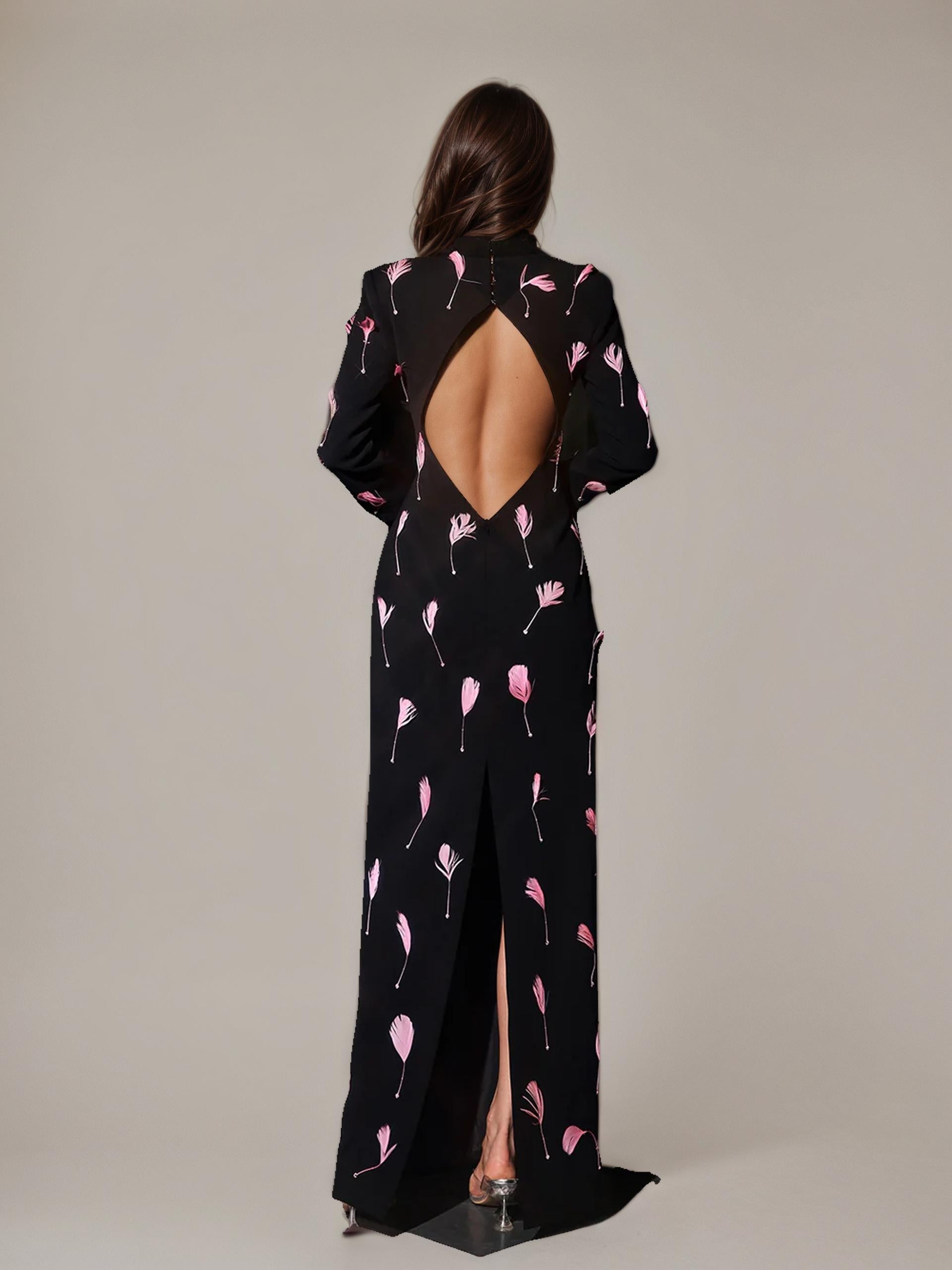 sleek black fabric with dramatic pink feather embellishments