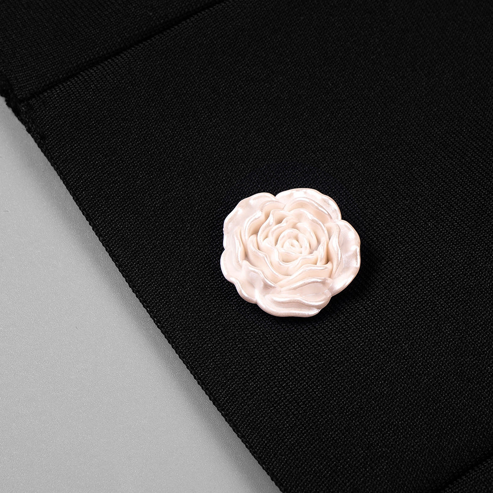 3D rose-shaped resin button detail on bandage knit