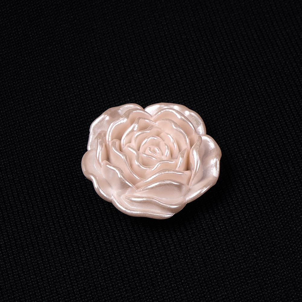 3D rose-shaped resin button detail