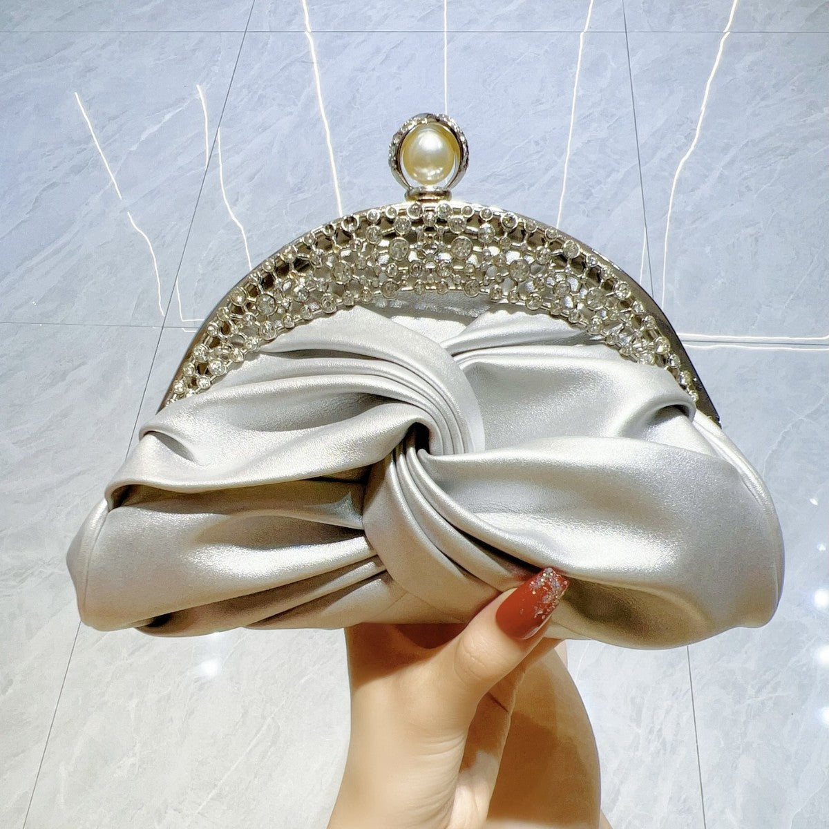 Diamond-Encrusted Pleated Clutch with Pearl Clasp — silhouette