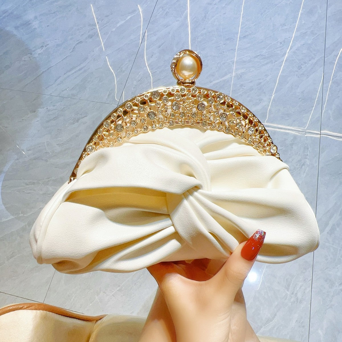 Diamond-Encrusted Pleated Clutch with Pearl Clasp — side view