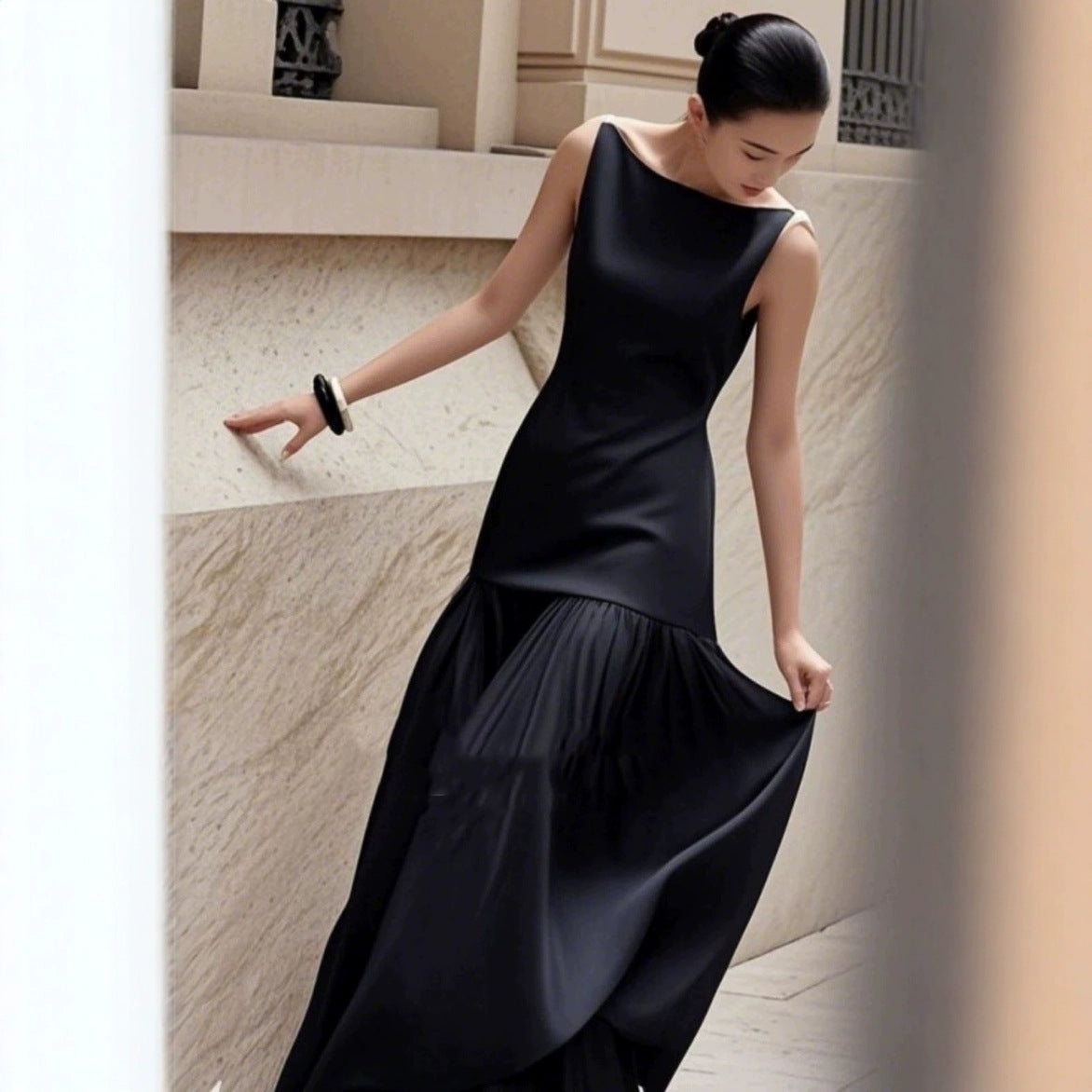Dress high-end light luxury women's 2026 new niche resort French fragrance black sleeveless patchwork dress — front view