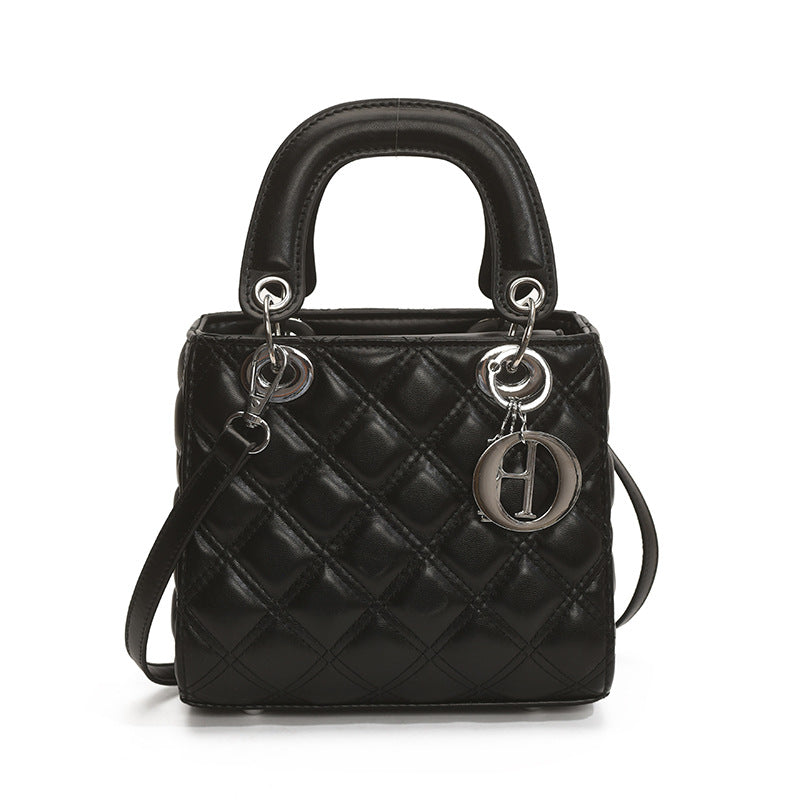 Quilted Embroidered Crossbody Bag — neckline detail
