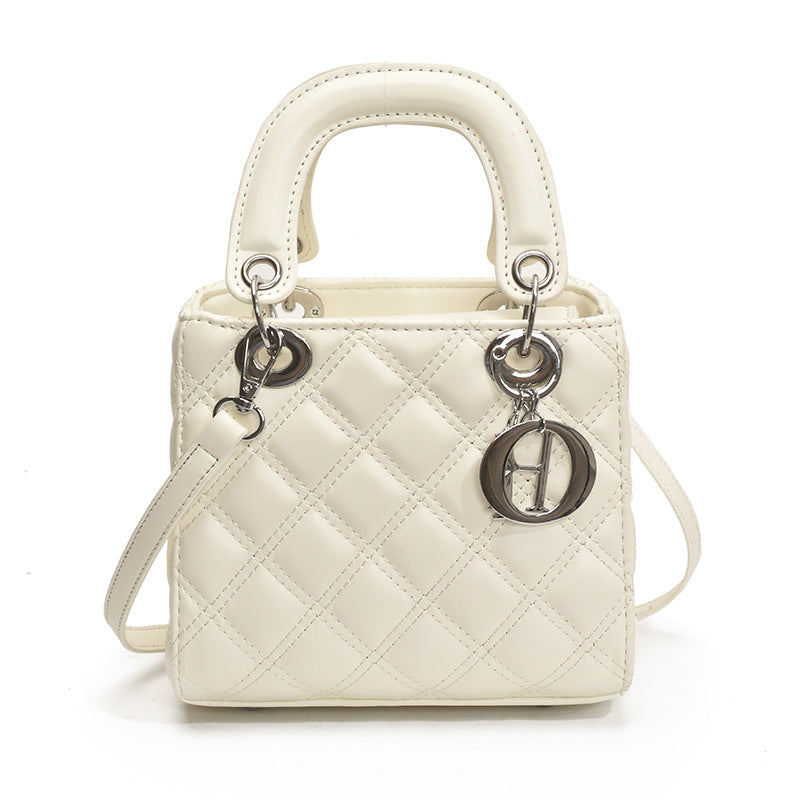 Quilted Embroidered Crossbody Bag — hem detail