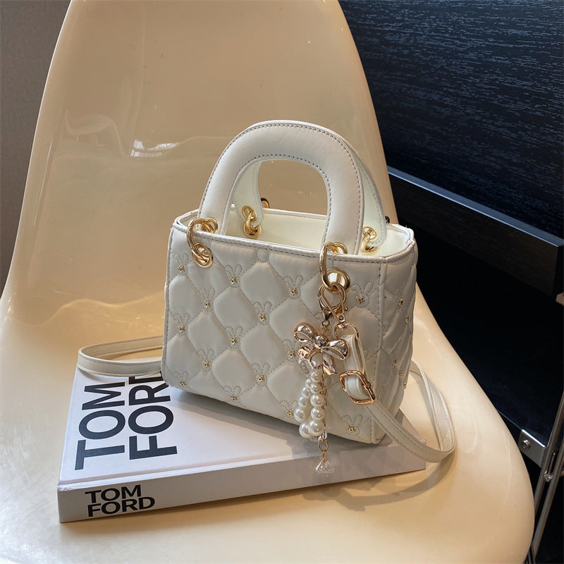 Quilted Diamond Lattice Mini Handbag with Pearl Charm — front view