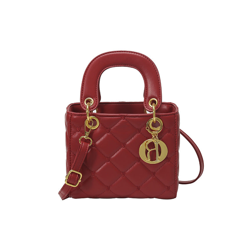 Quilted Diamond Lattice Mini Handbag with Pearl Charm — neckline detail