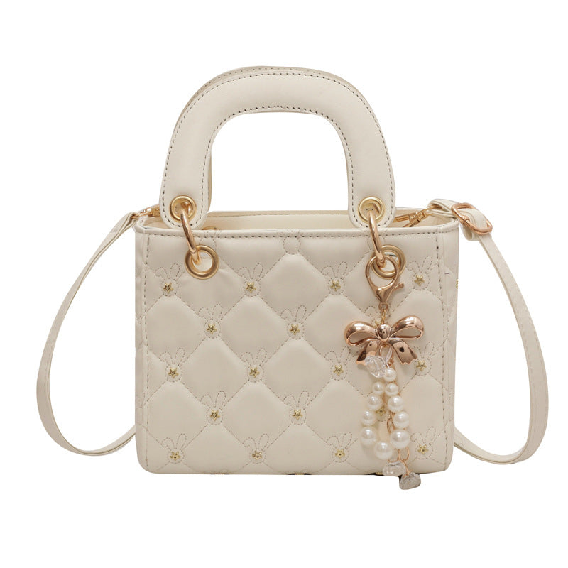 Quilted Diamond Lattice Mini Handbag with Pearl Charm — close-up detail