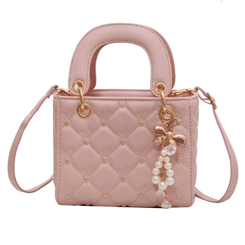 Quilted Diamond Lattice Mini Handbag with Pearl Charm — model wearing