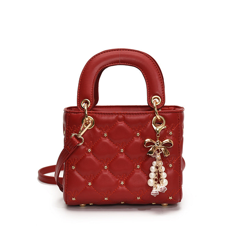 Quilted Diamond Lattice Mini Handbag with Pearl Charm — runway angle