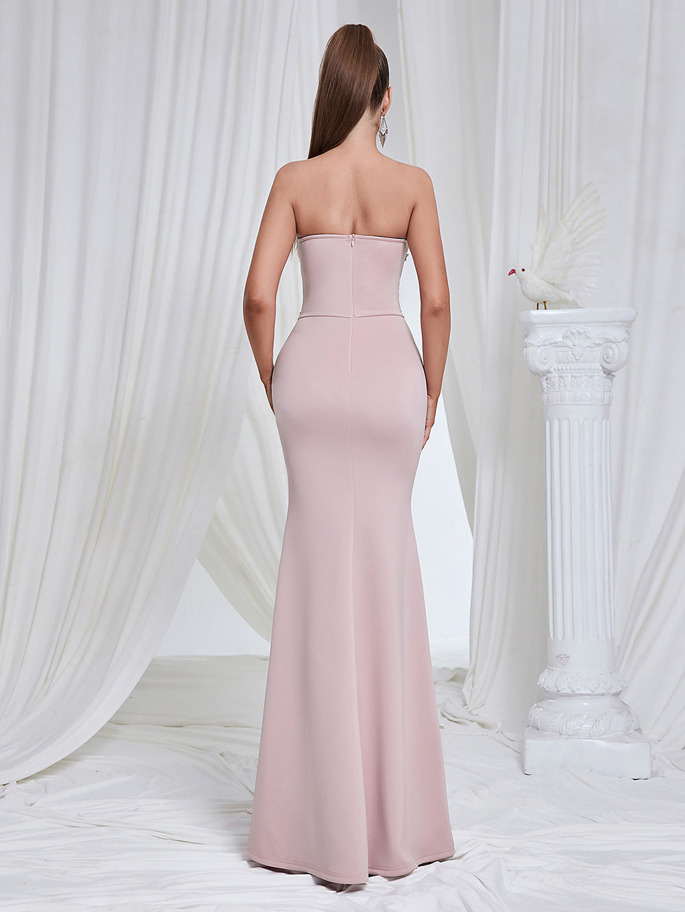 Marceline blush lace-corset strapless evening gown — back view on model showing the back zipper