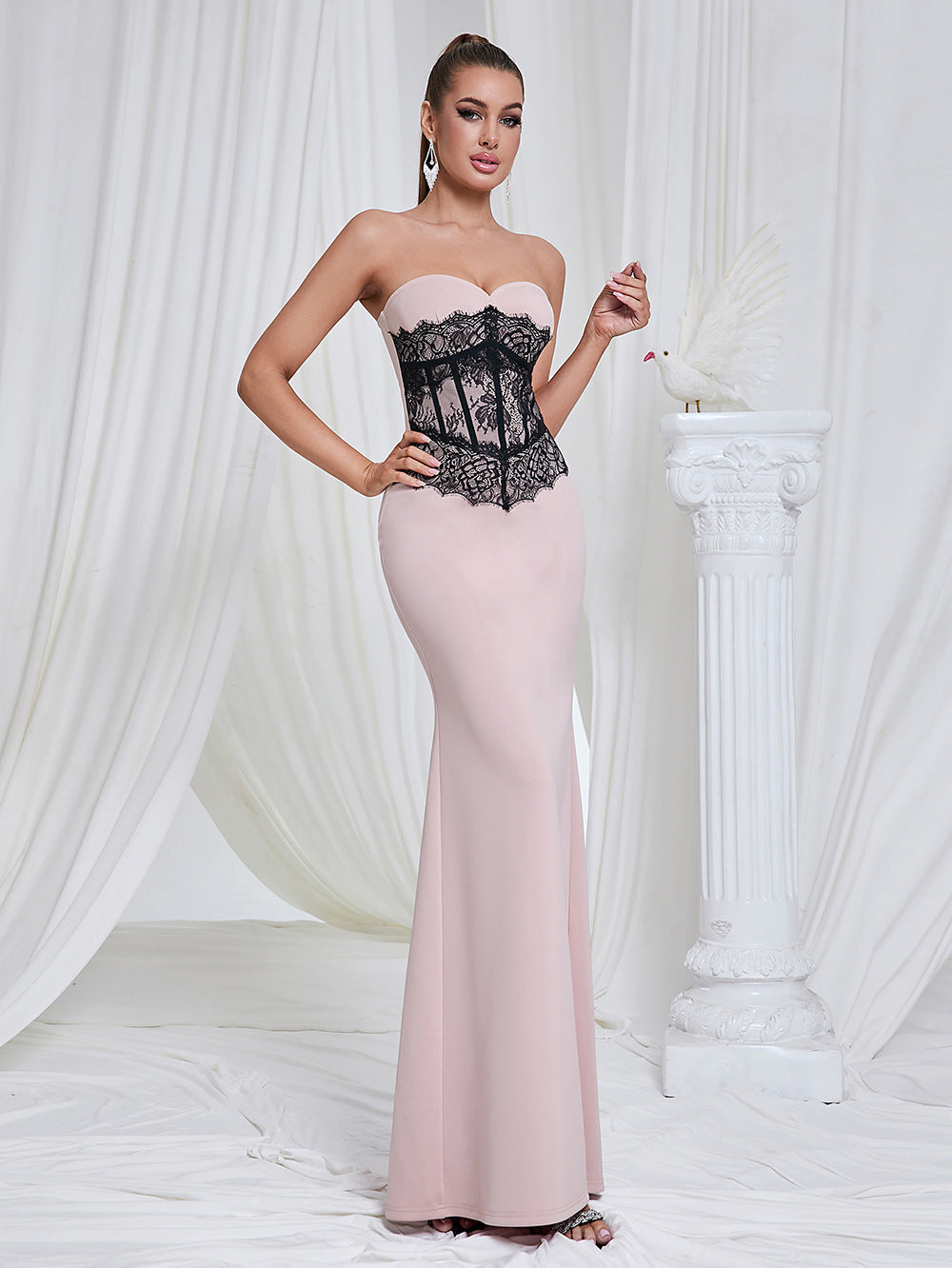 Marceline blush lace-corset strapless evening gown — front view on model, sweetheart neckline with black lace waist panel