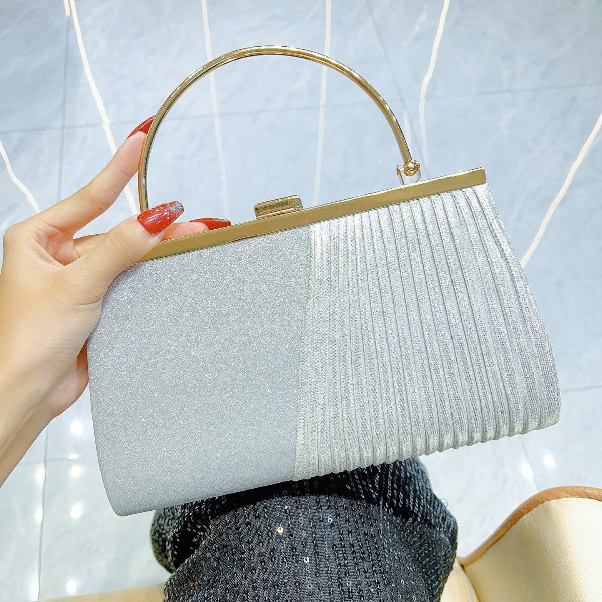 Sparkling Pleated Frame Clutch with Half-Ring Handle — close-up detail