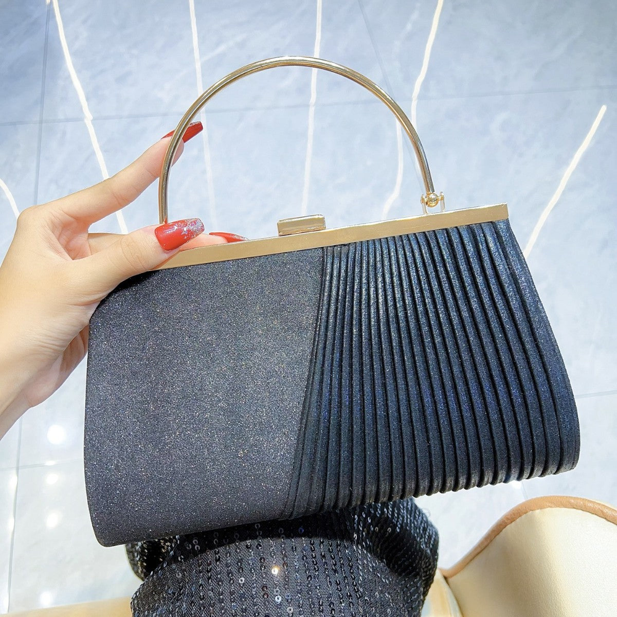 Sparkling Pleated Frame Clutch with Half-Ring Handle — model wearing