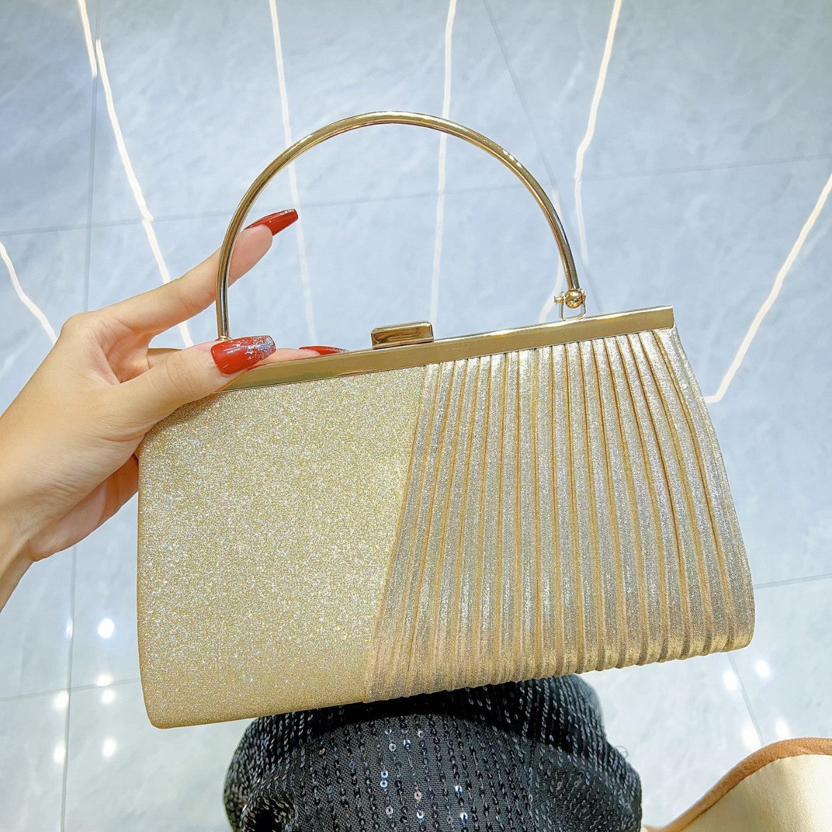 Sparkling Pleated Frame Clutch with Half-Ring Handle — runway angle