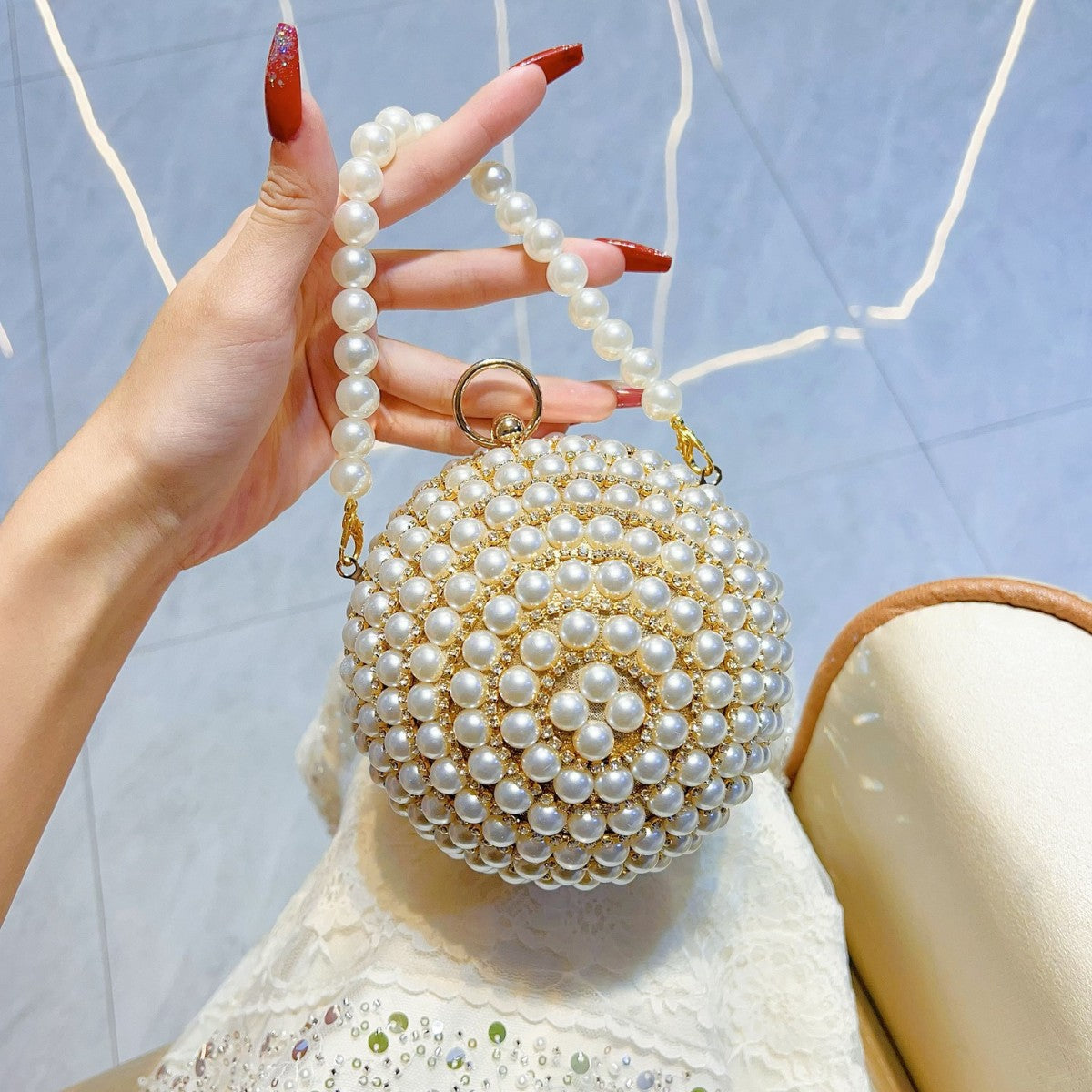 Pearl-Encrusted Italian-Inspired Spherical Evening Bag — model wearing