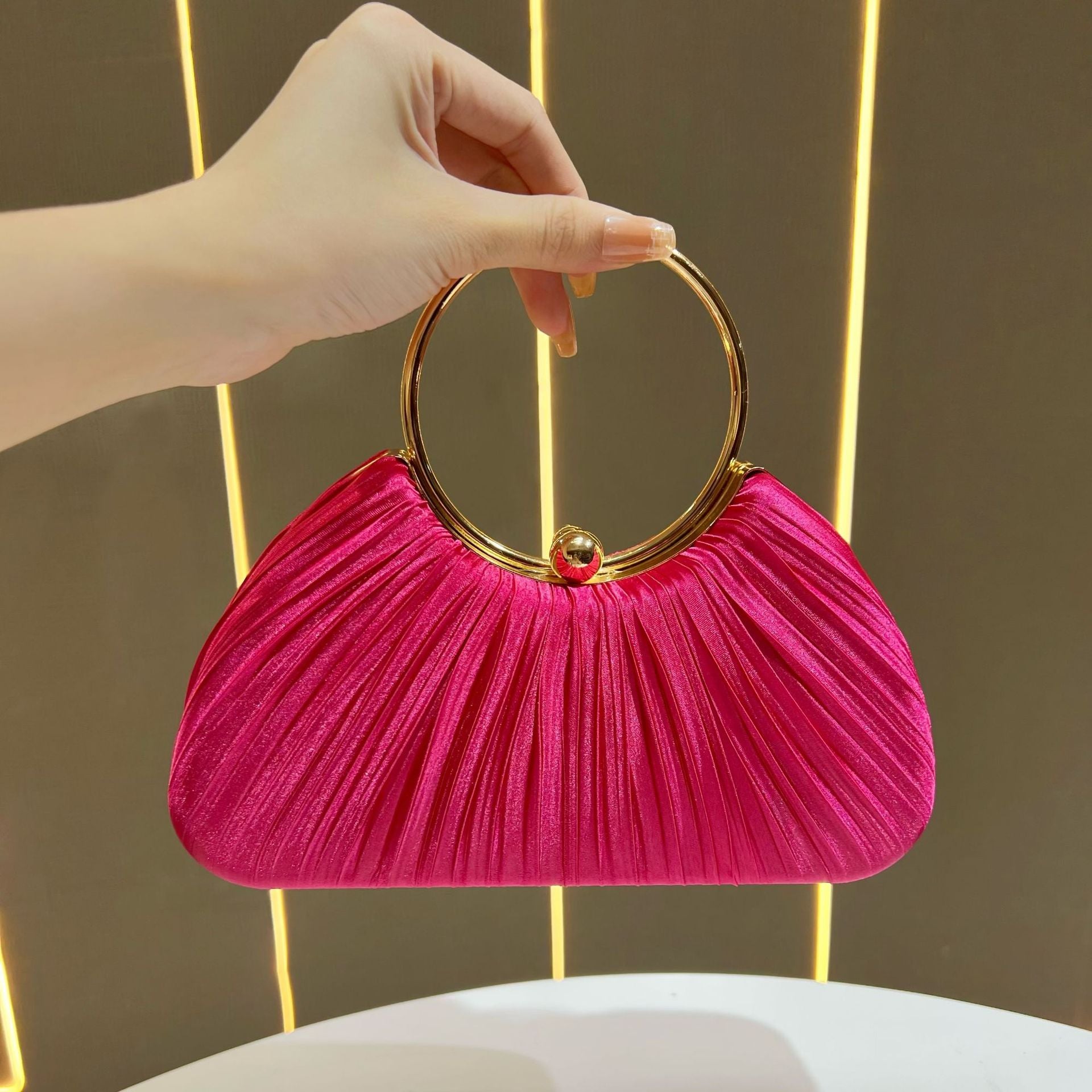 Pleated Satin Evening Bag with Gold Ring Handle — hem detail