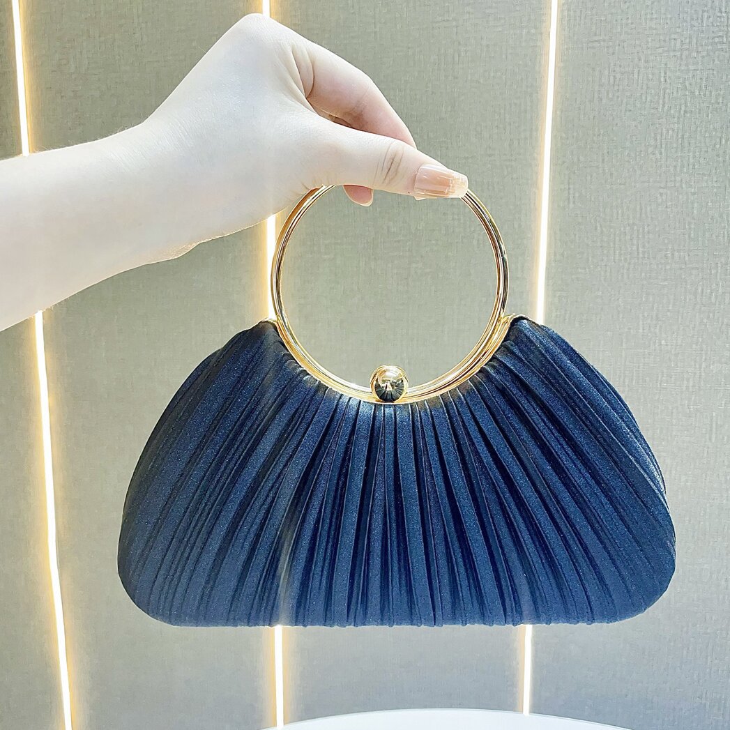 Pleated Satin Evening Bag with Gold Ring Handle — close-up detail