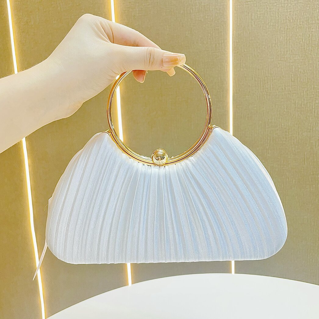 Pleated Satin Evening Bag with Gold Ring Handle — model wearing