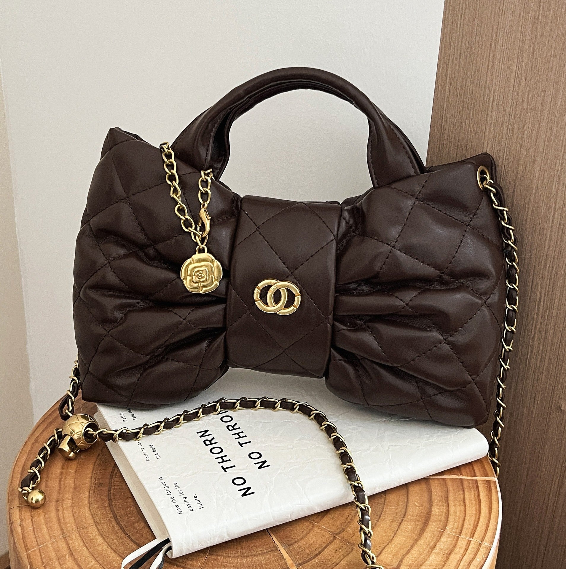 Quilted Bow Chain Evening Bag — front view