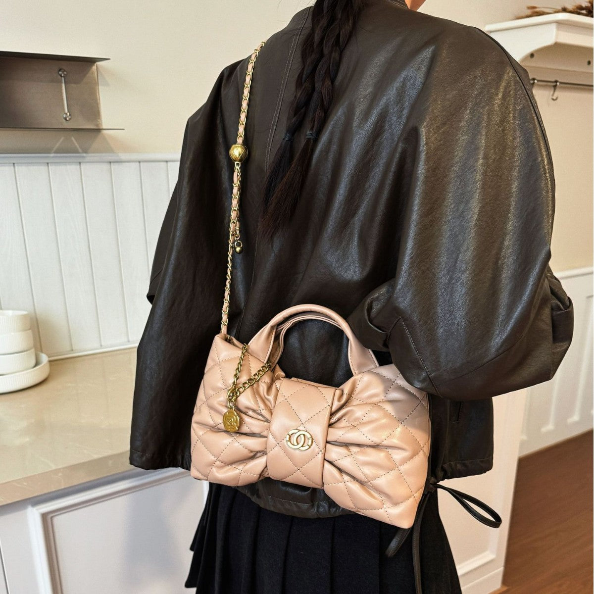 Quilted Bow Chain Evening Bag — fabric and detail