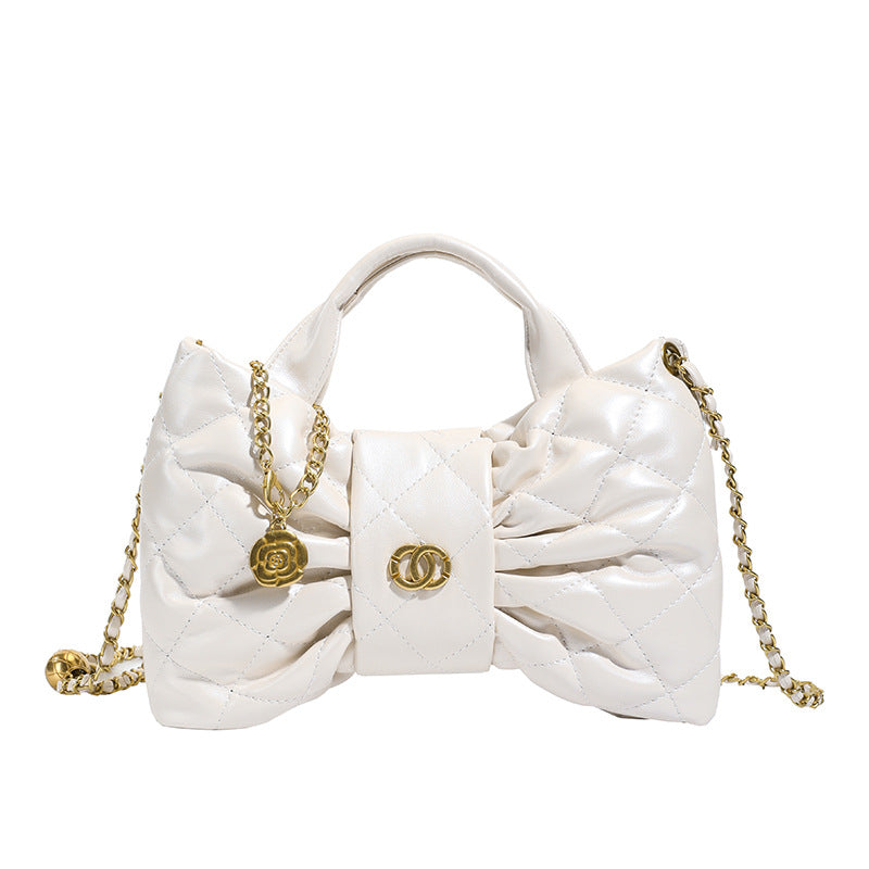 Quilted Bow Chain Evening Bag — close-up detail