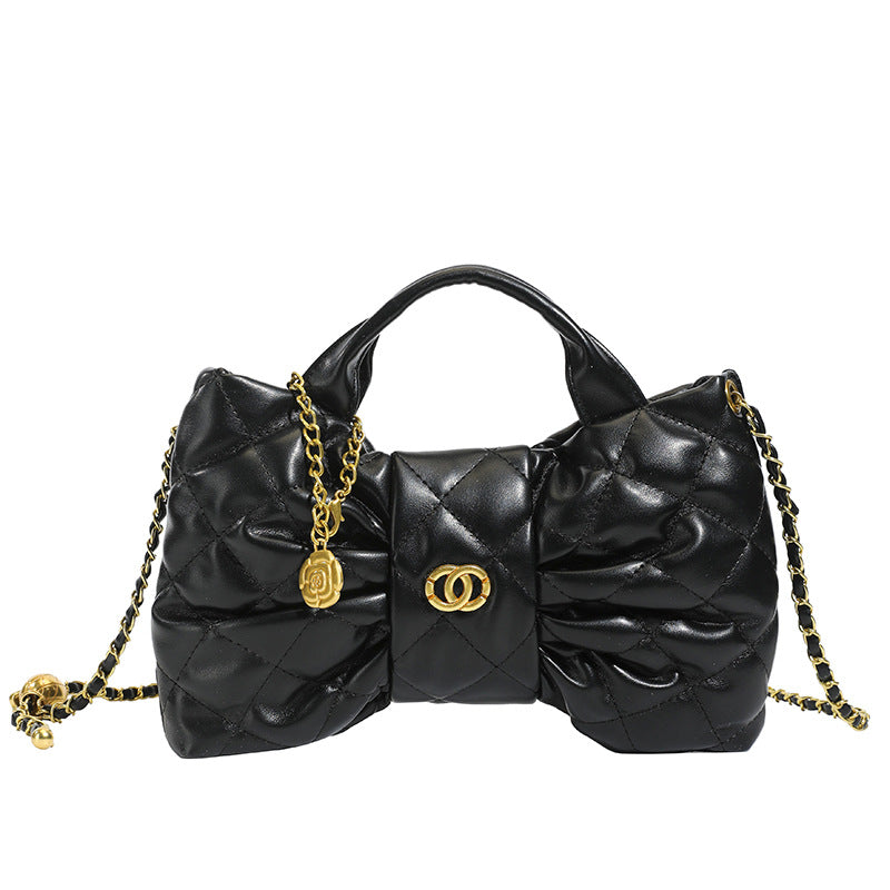 Quilted Bow Chain Evening Bag — model wearing