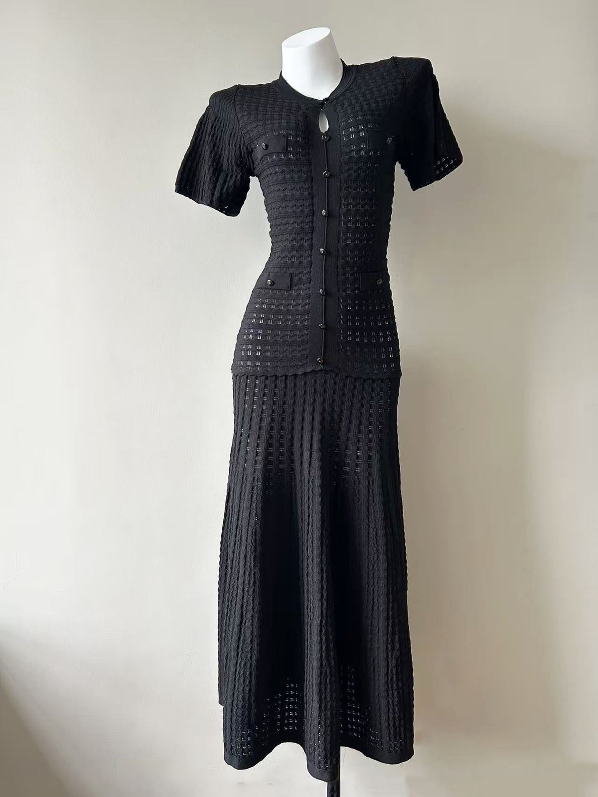 Black pointelle knit flared maxi dress