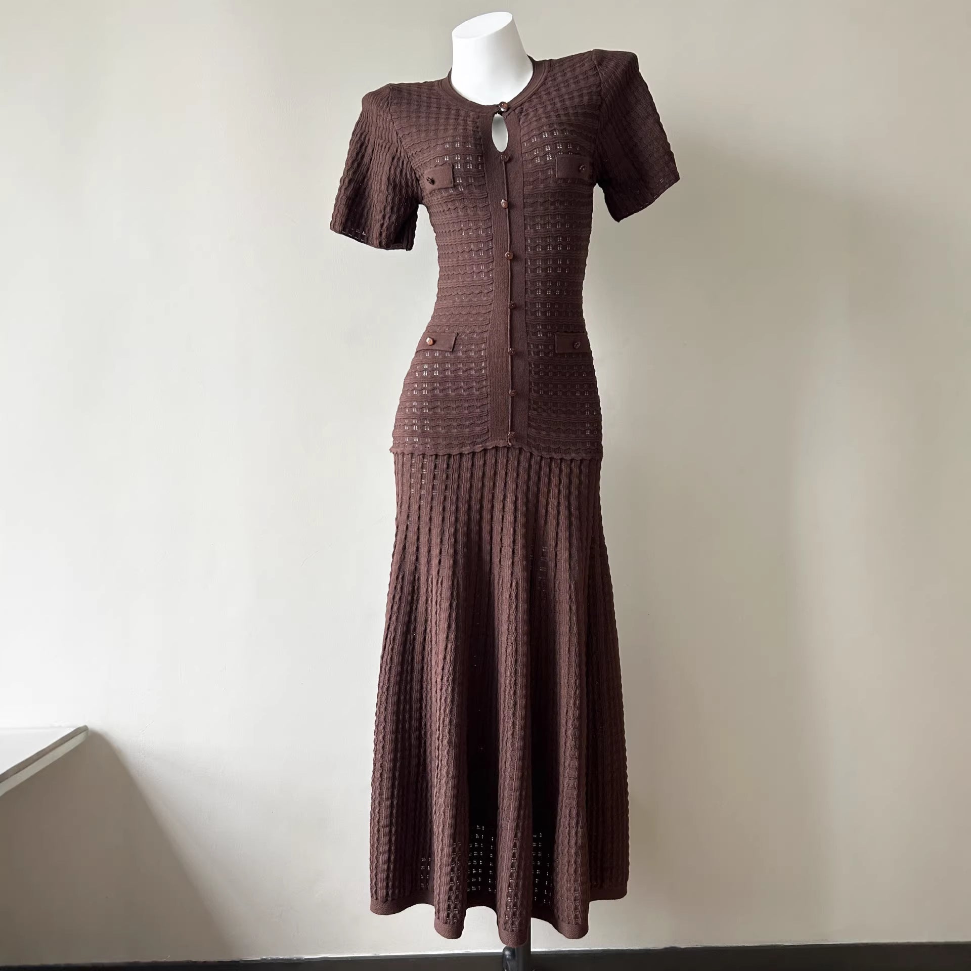 Brown pointelle knit maxi dress on a mannequin