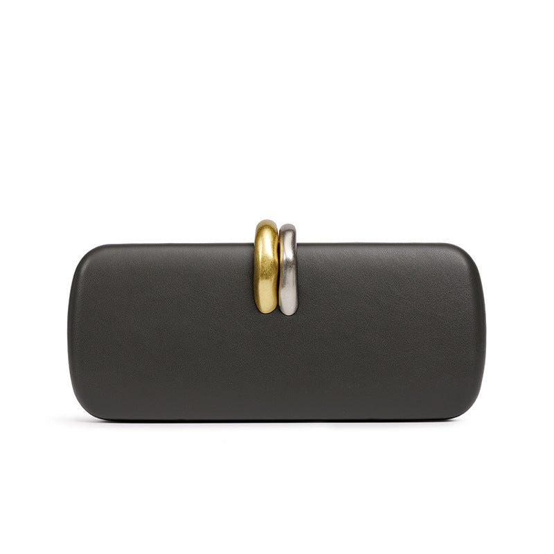 Sculptural Two-Tone Clasp Evening Clutch — silhouette