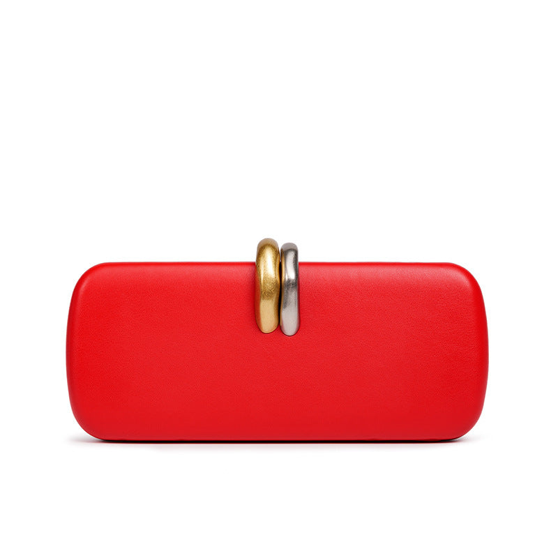 Sculptural Two-Tone Clasp Evening Clutch — neckline detail