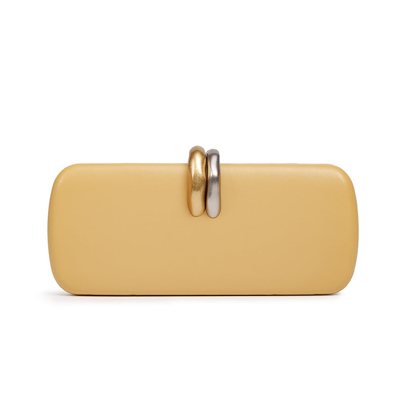 Sculptural Two-Tone Clasp Evening Clutch — hem detail