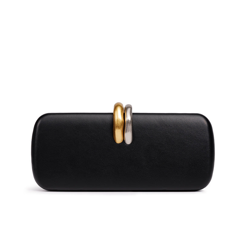 Sculptural Two-Tone Clasp Evening Clutch — side view