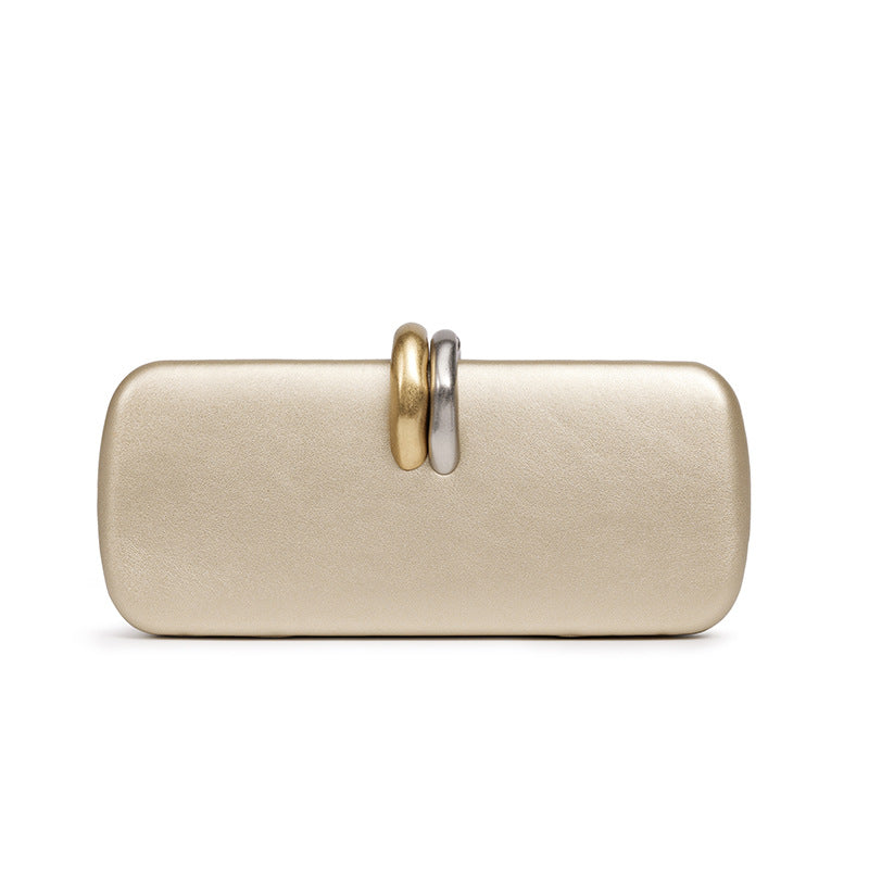 Sculptural Two-Tone Clasp Evening Clutch — model wearing