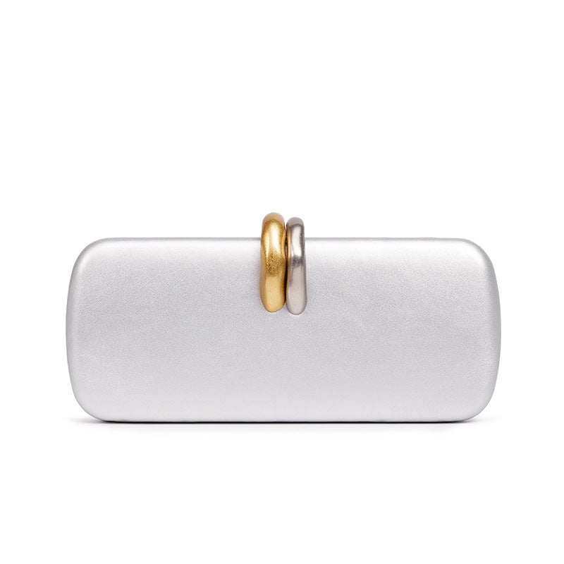 Sculptural Two-Tone Clasp Evening Clutch — runway angle