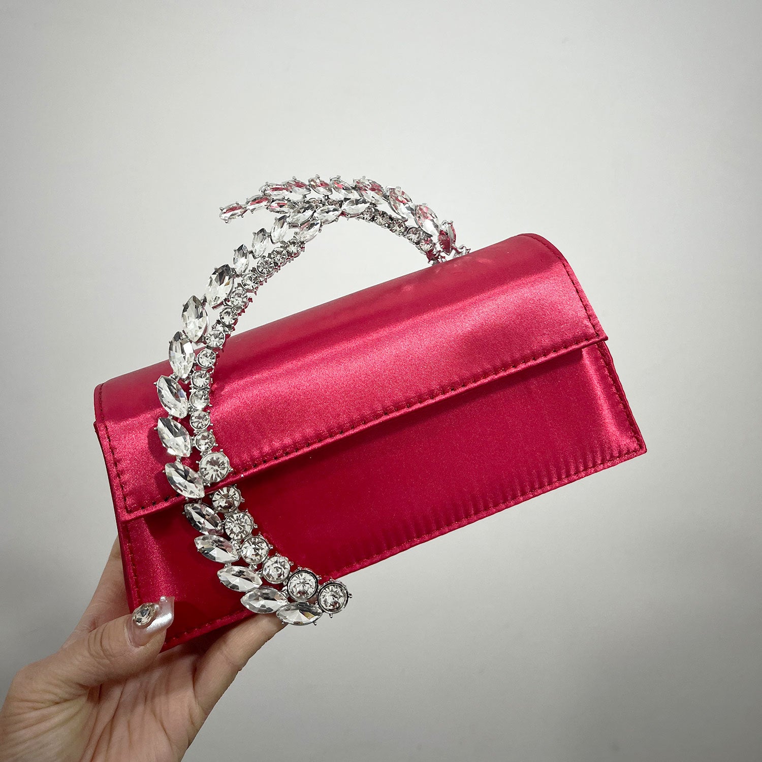 Theia Hardware-Detailed Evening Clutch — neckline detail