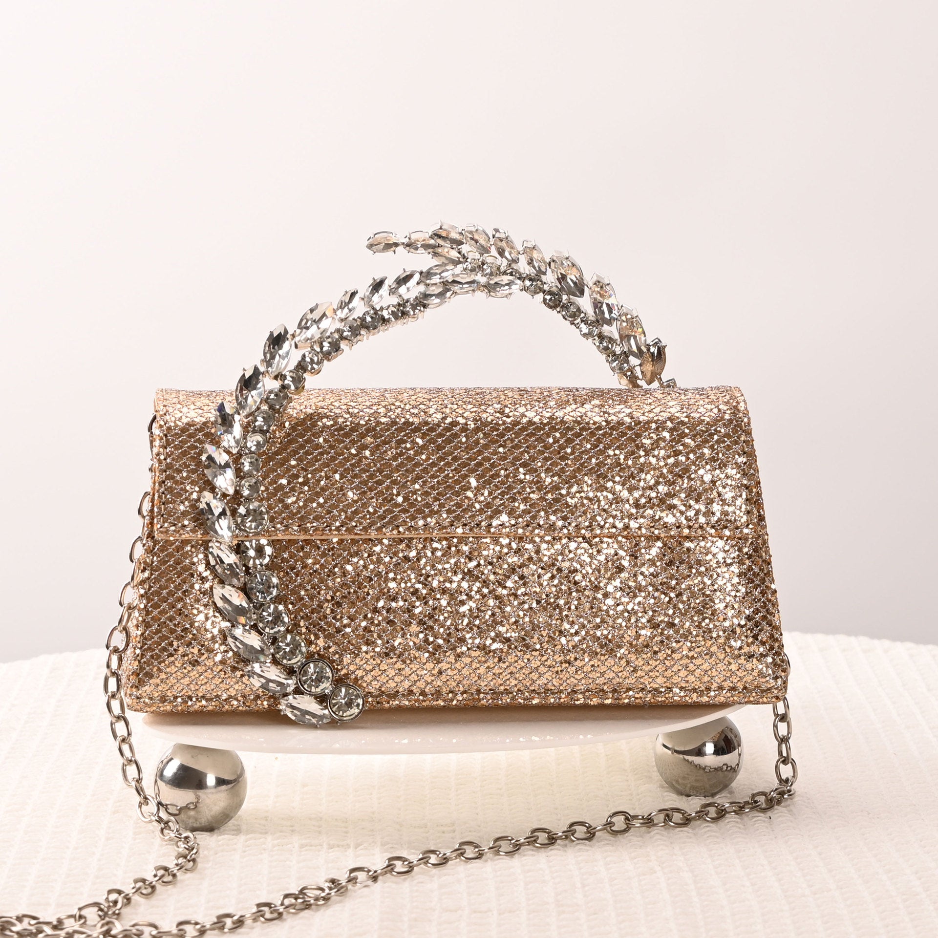 Theia Hardware-Detailed Evening Clutch — model wearing